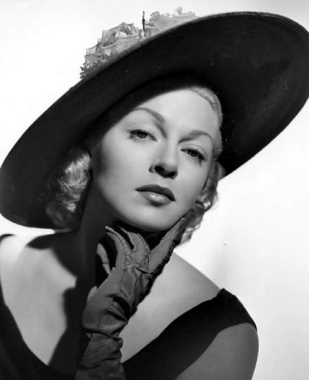 Lana Turner  portrait with  gloves and hat. 1951 promo photo/USPD:pub.date/Commons.wikimedia.org