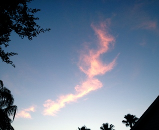 odd pink cloud in blue sky ALL rights reserved. Copyrighted. No permissions granted