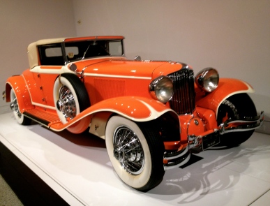Car. side view of orange Art Deco exhibit vehicle . ALL rights reserved. Copyrighted. NO permissions granted