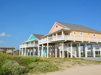 Some of the new beach houses built after Hurricane Ike. Owning a beach house sounds like such a good idea - until memories of September storms float to the surface. Maybe beach houses are like horses: best if your neighbor has one and is willing to share. (Image: boliverpeninsulatexas.com)