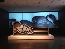 Moving wave screen behind Vortex bookcase by Joris Laarman Lab. (MFAH exhibit/ image copyrighted, no permissions granted, all rights reserved)
