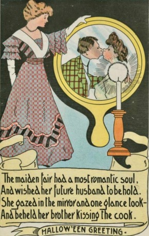 Vintage woman looking into mirror tio see couple kissing. Halloween greeting card. Vintage. T.R.Co. NYpub.library (USPD.pub.date/Commons.wikimedia.org)