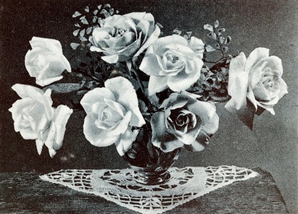 Vintage roses in vase with crochet doily (1943 Mother's Day greeting card/USPD.pub.date, artist life/Commons.wikimedia.org)