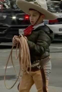 Boy with rope trick rope in traditional dress and sombrero (Houstonrodeo screenshot)