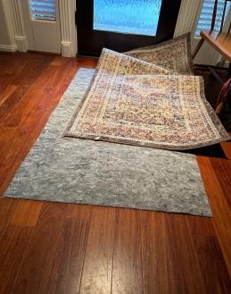 Rumpled rug due to dog traffic. (© Image copyrighted, all rights reserved, no permissions granted)