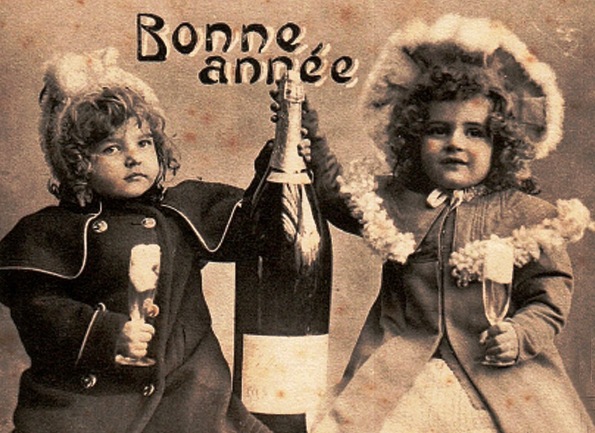 Two Children with champagne. French postcard, 1900's (USPD. pub. date, artist life/COmmons.wikimedia.org)