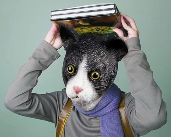 Person in realistic cat mask holding books over head. (Image: Amazon)